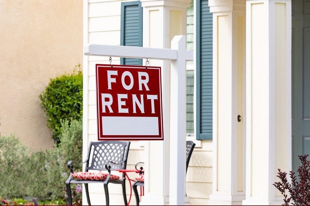 A for rent sign outside of a home that is part of the cost of property management.